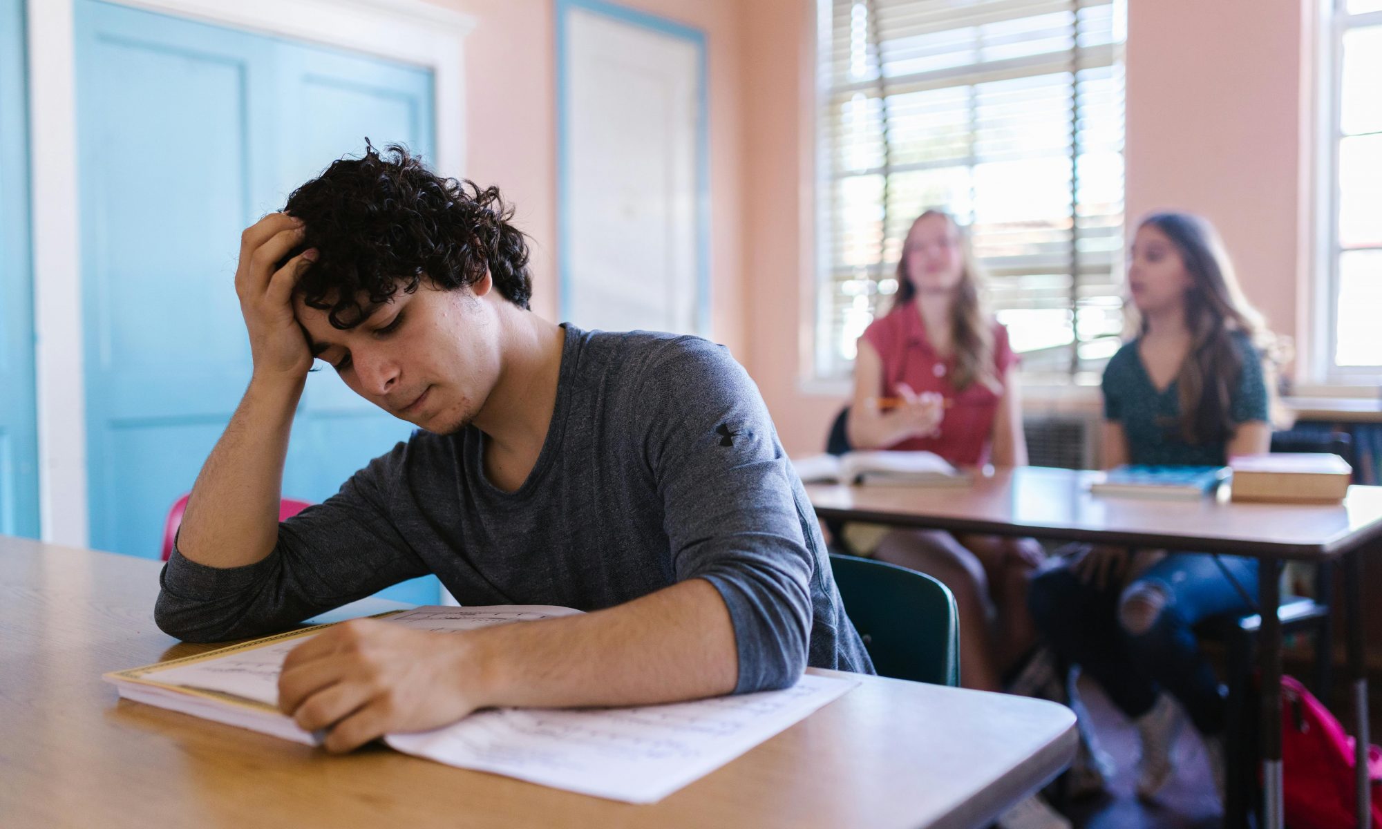 High school student reads hacks on how to write a college essay